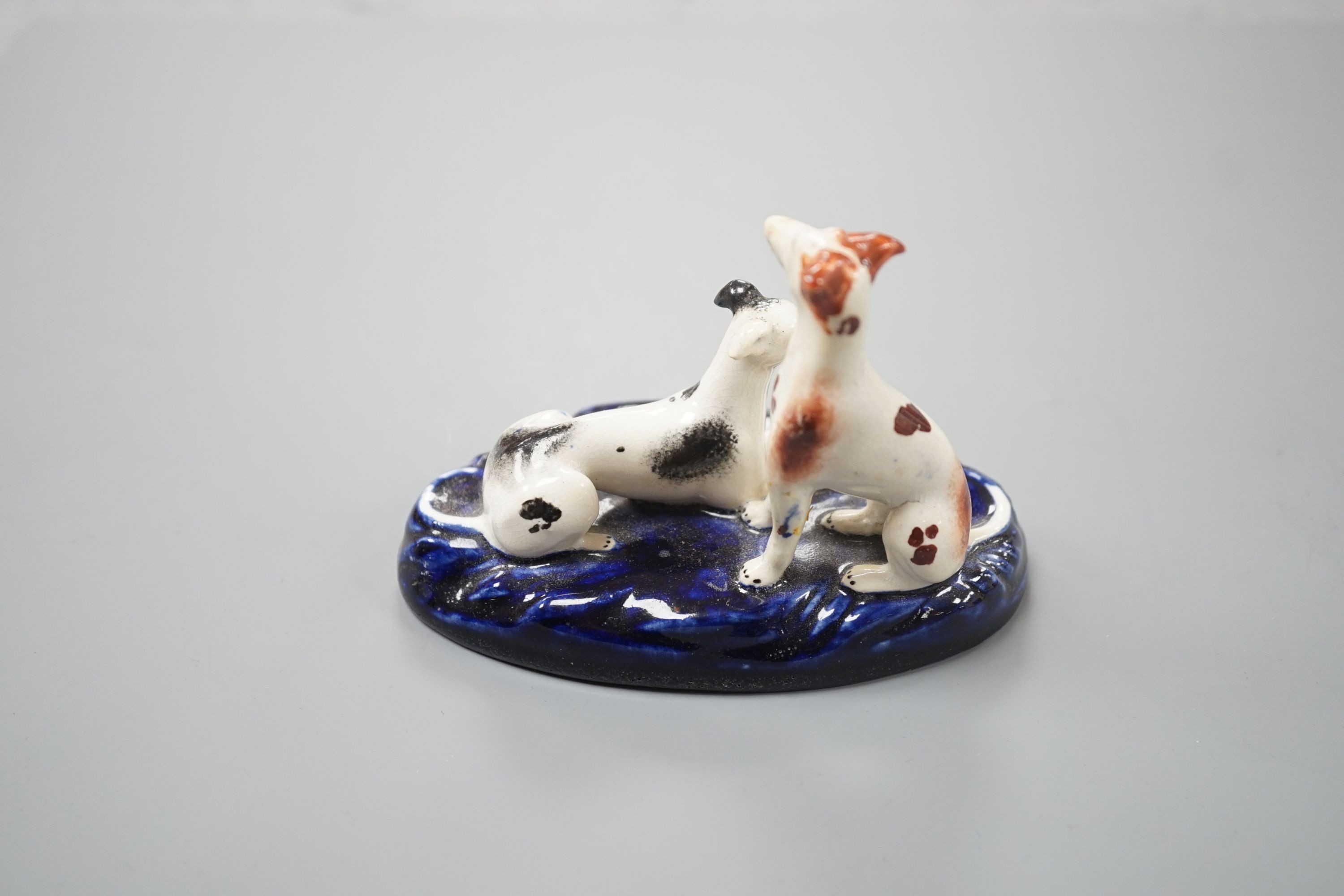 A Staffordshire porcelain group of two greyhounds, c.1835-50, 10.5 cm long, Provenance: Dennis G.Rice collection